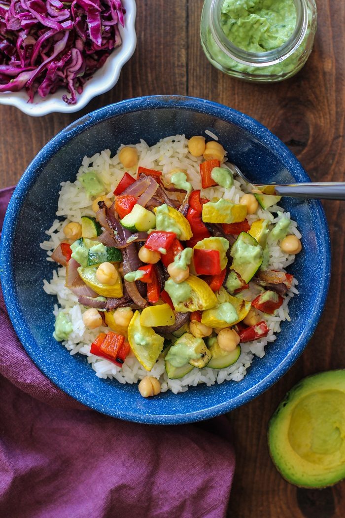 Roasted Summer Vegetable Burrito Bowls with Avocado Basil Crema from The Roasted Root